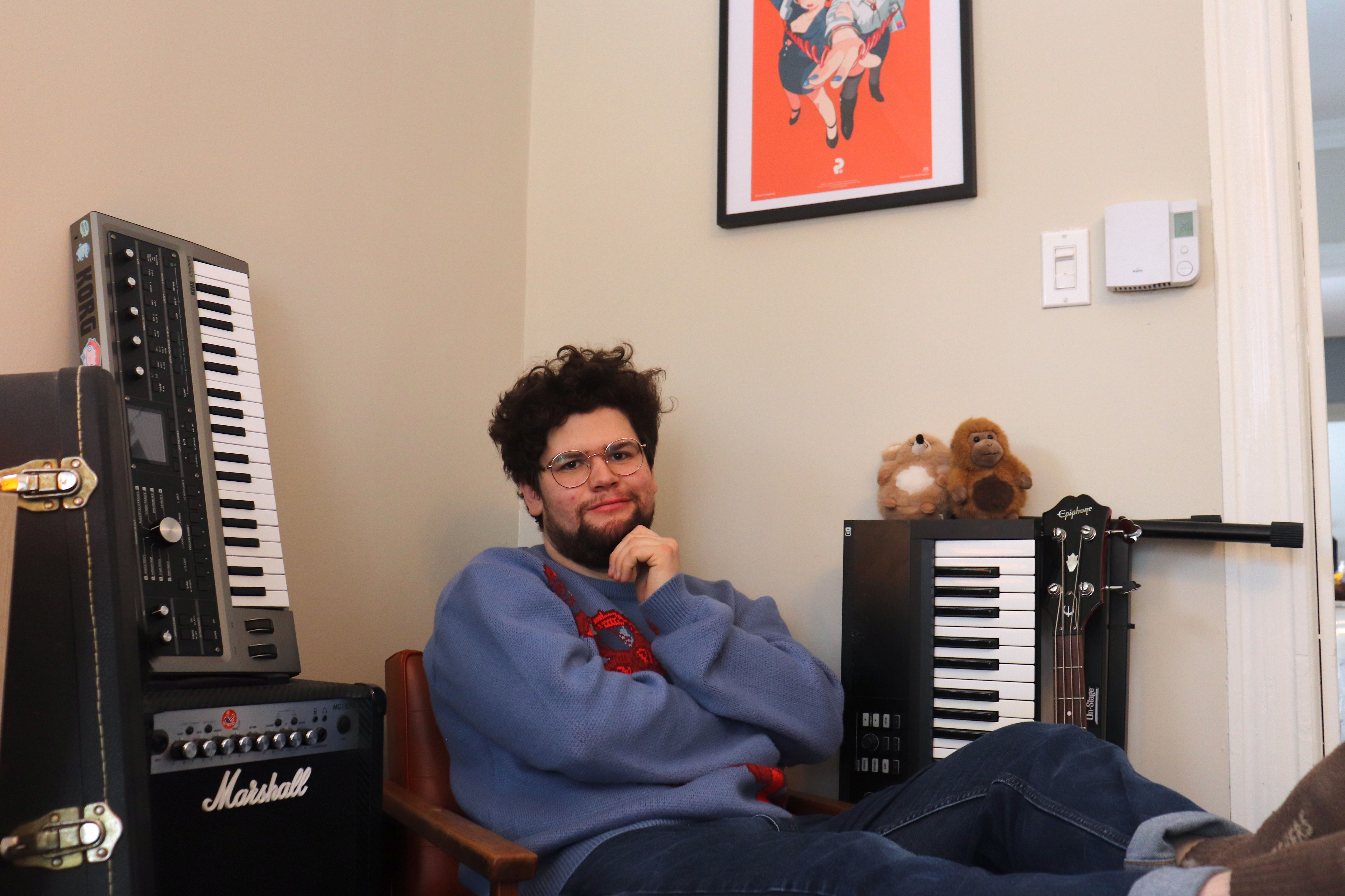 person sitting in chair surrounded by instruments